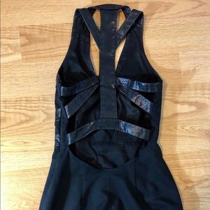 Caged open back Bebe dress with leather trim